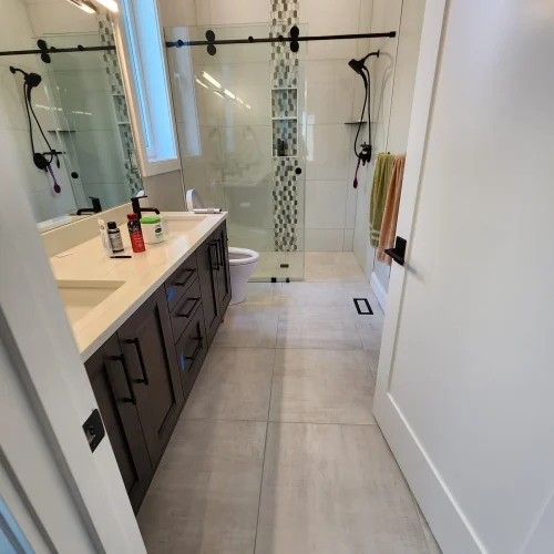 modern-bathroom-with-dark-wood-vanity-and-walk-in-shower