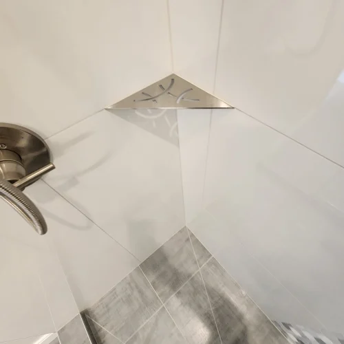 modern-shower-corner-with-metal-shelf